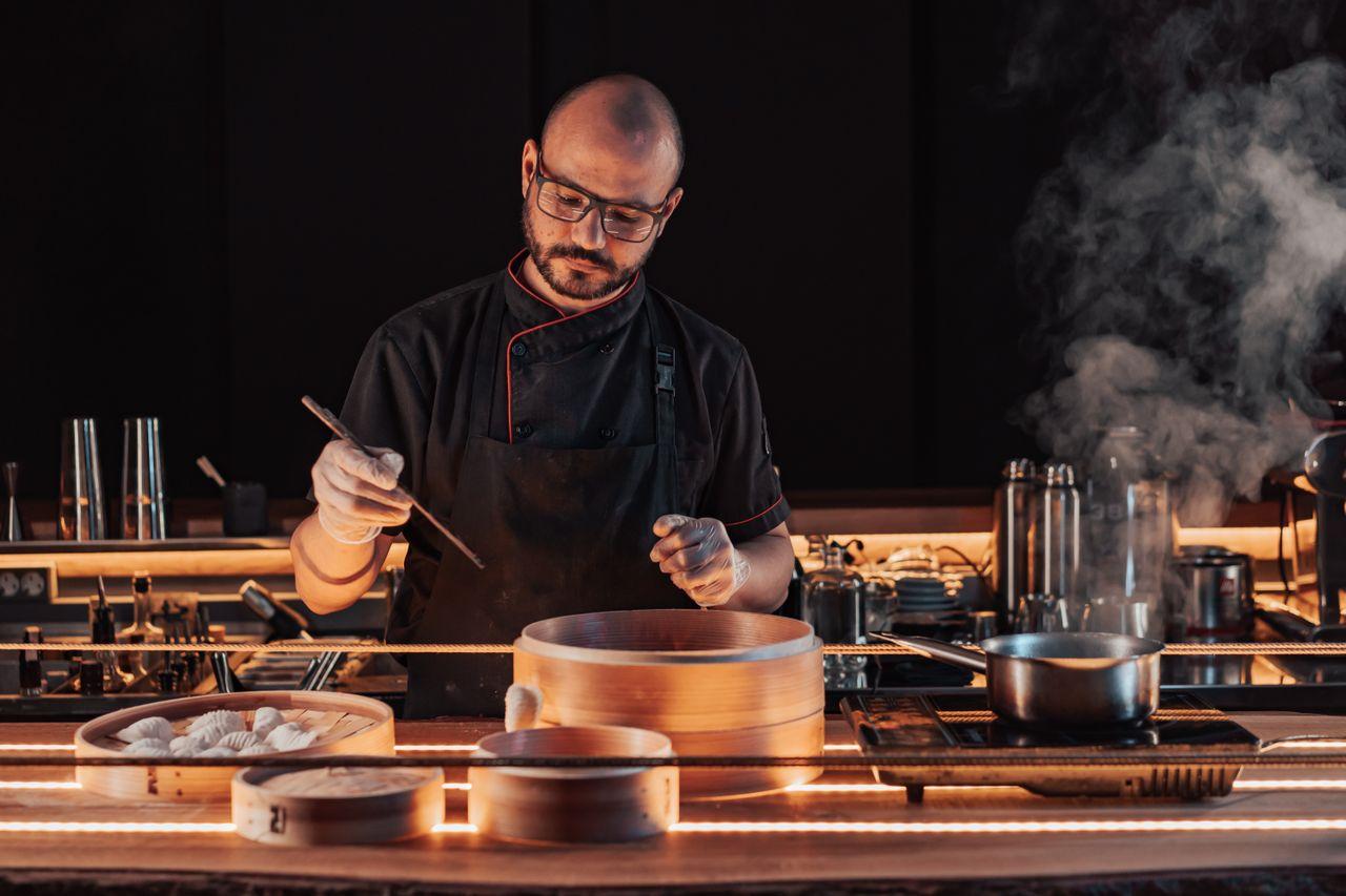 Restaurant owner reviewing suppliers, inventory, and daily figures