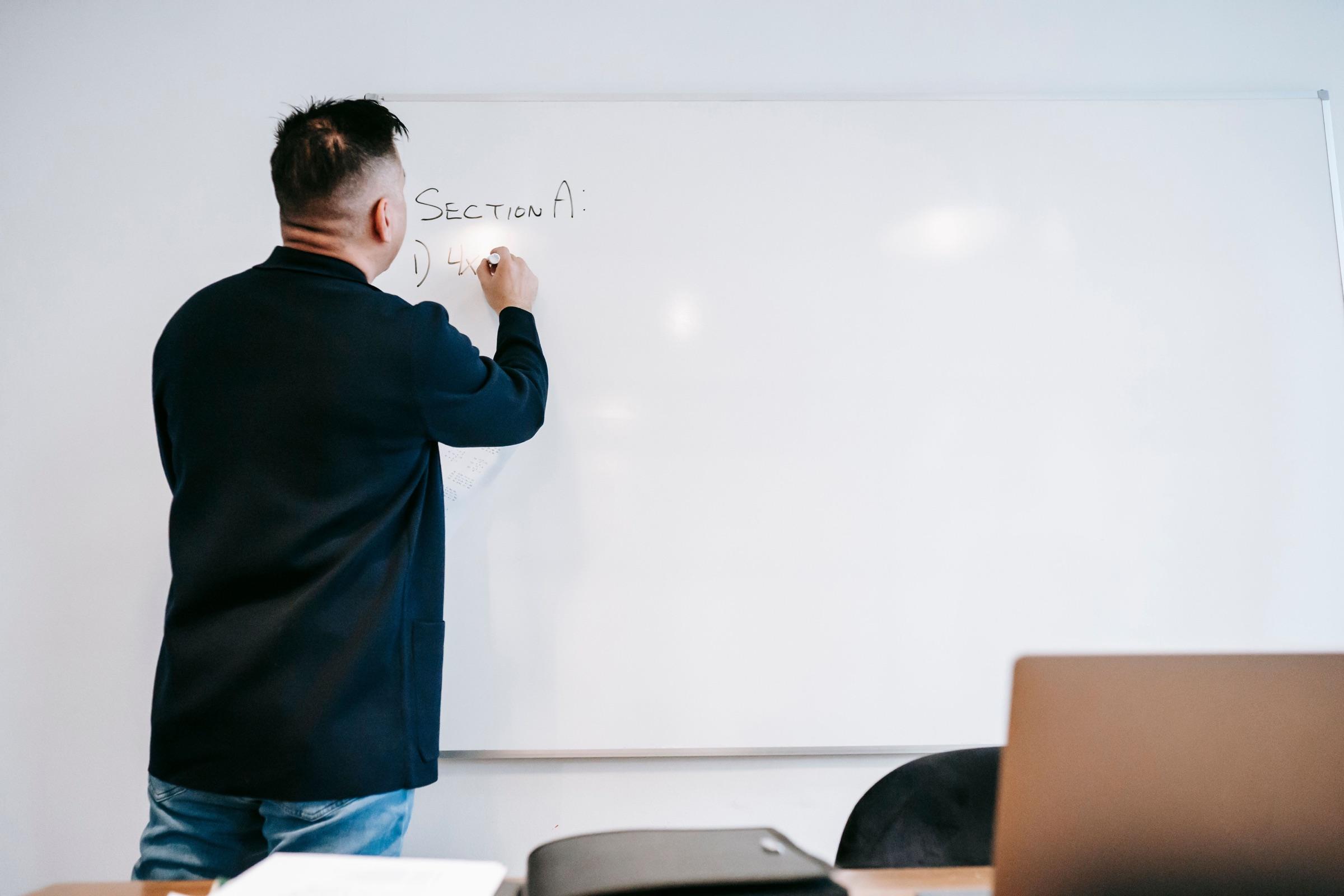 A Figena specialist mapping a customer workflow on a whiteboard